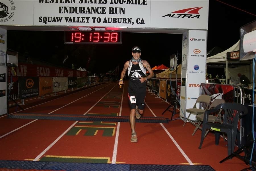 Ricky Roane finishing the Western States 100, Squaw Valley to Auburn, race clock reading 19:13.